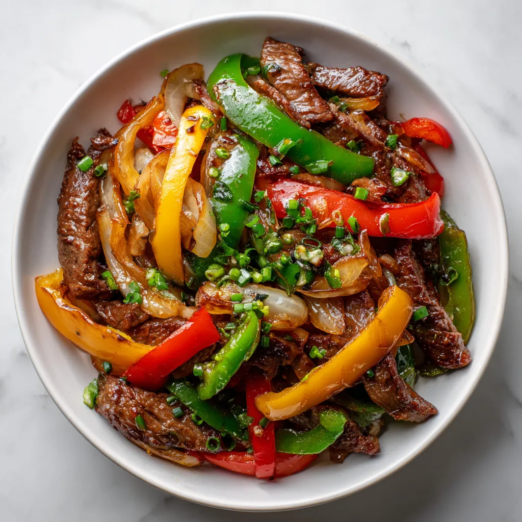 Classic Pepper Steak with Colorful Bell Peppers and Sweet Onions in Savory Sauce - secondary view